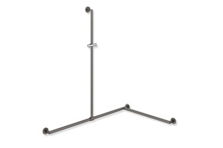 Rail with sideways adjustable vertical support bar and shower head holder  by  HEWI